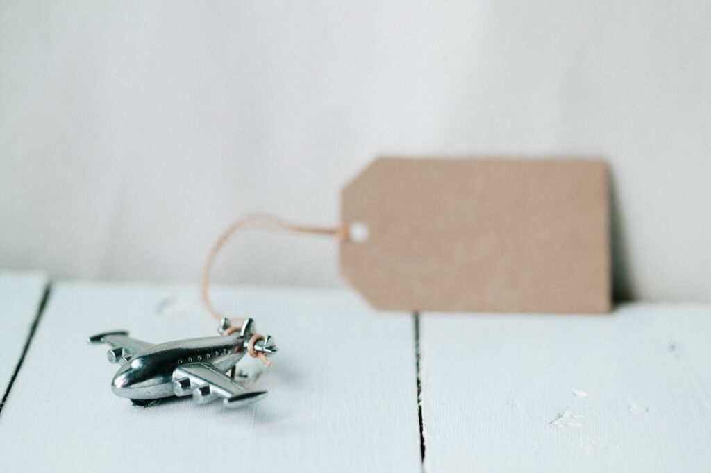 A toy airplane with a blank tag, ideal for travel concept or gift ideas.